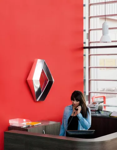 Woman on the phone in a Renault Trucks dealership